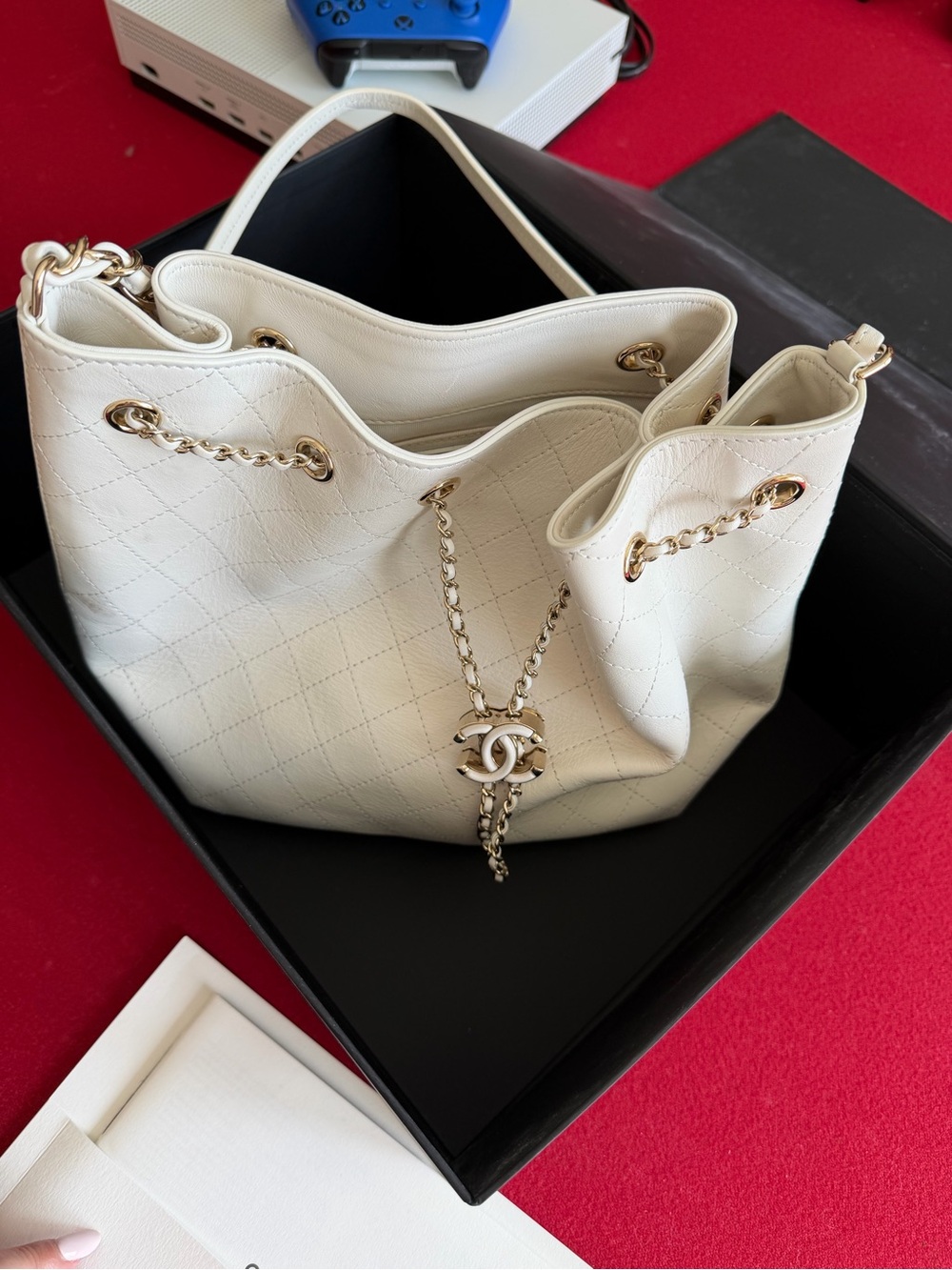 CHANEL Cream Quilted Drawstring Bucket Bag with Gold Chain